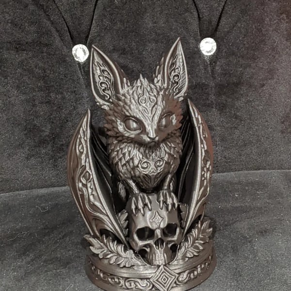 Gothic Style bat perched on a skull home decor ornament