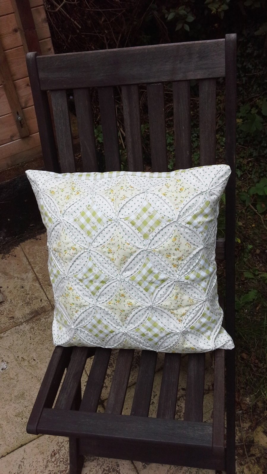 Cathedral window patchwork cushion