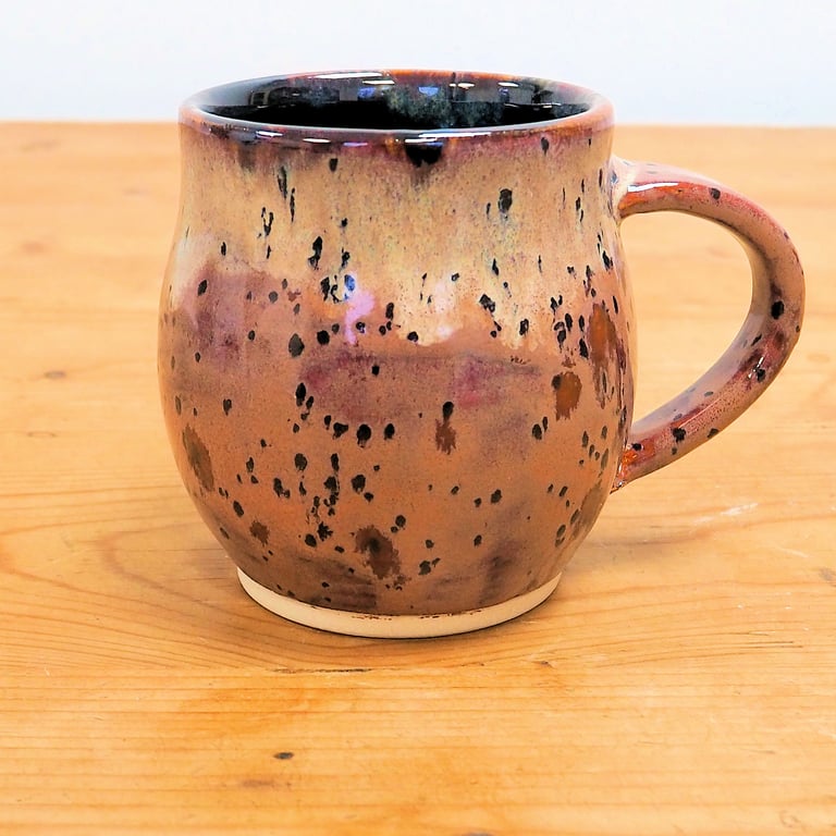 Large pottery mug finished in multi-coloured purple plum glaze, handmade