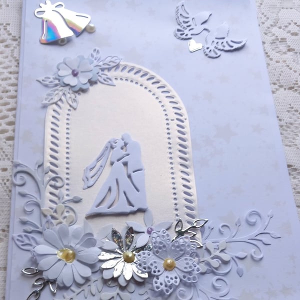 luxury 3d wedding card in white, silver,  beautiful flower spray, bride groom 