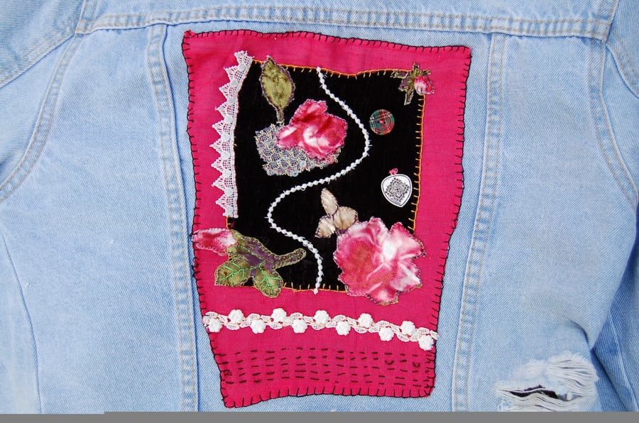 Upcycled Age 14 Denim jacket with floral design on back.  Slow stitched. 