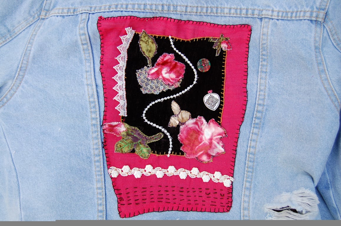 Upcycled Age 14 Denim jacket with floral design on back.  Slow stitched. 