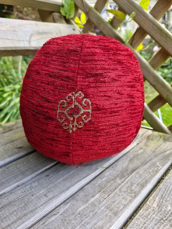 Small, decorative, christmas, red and gold fabric bauble ball.