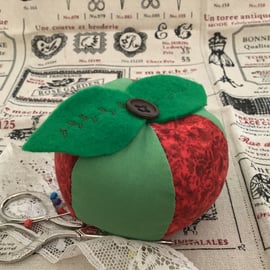 Cushion Sweet apple pincushion.  Red and green segments with vintage buttons.   