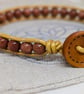 Goldstone and metallic gold leather bracelet with wooden button fastener  - Image 6