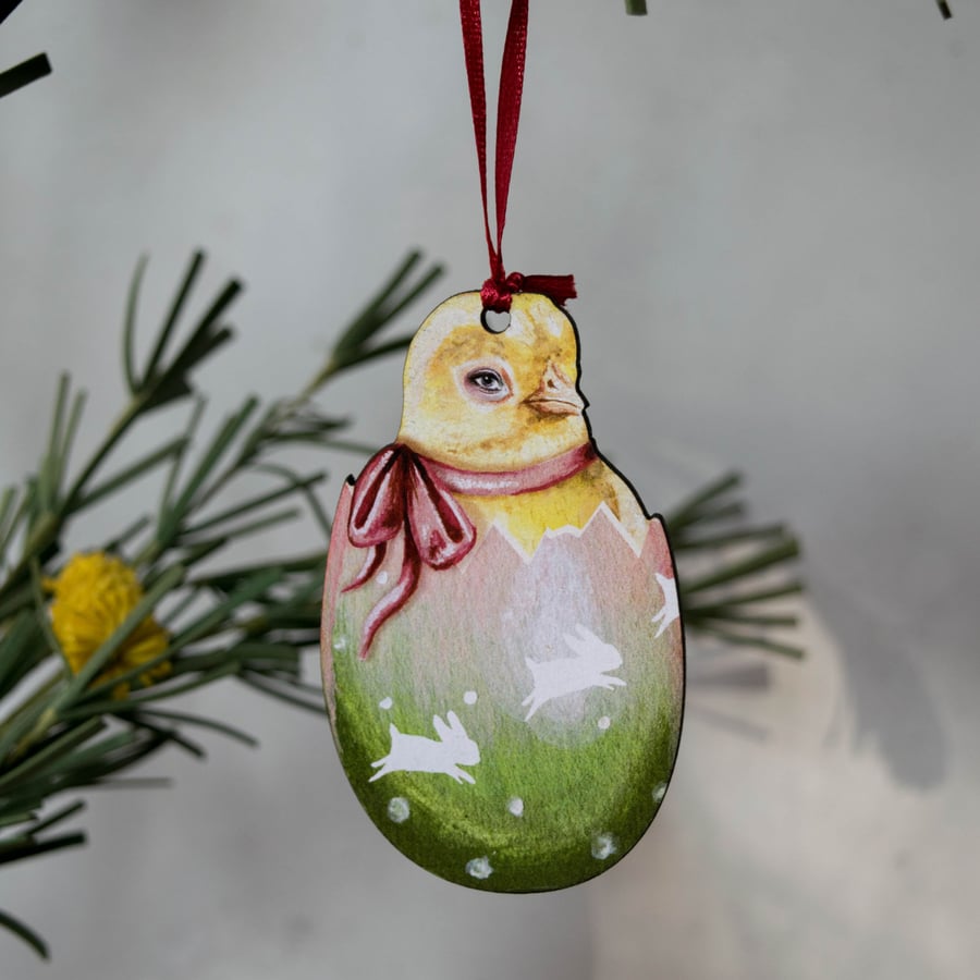 Yellow chick in an Easter egg wooden hanging decoration