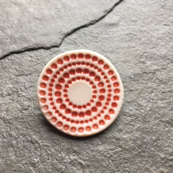 Spotty circles brooch, red glaze, white, porcelain, contemporary