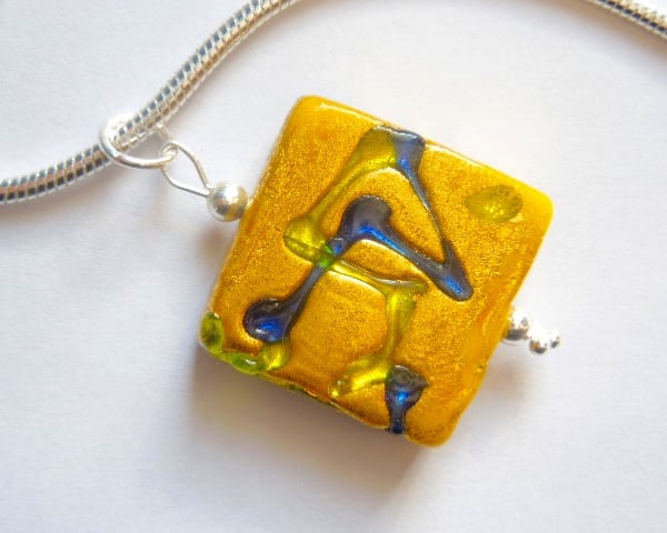  Murano glass gold square pendant with sterling silver snake chain.