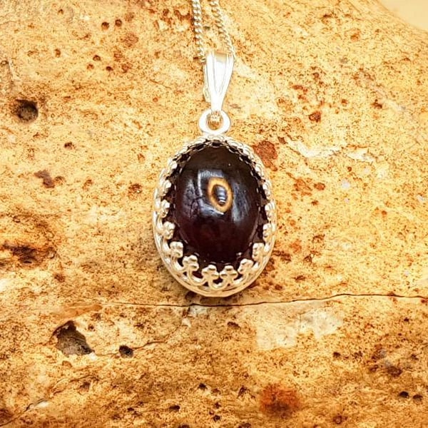 Small oval Garnet pendant. January Birthstone