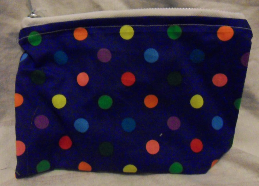 Homemade Pencil case. Coloured spots on blue fabric