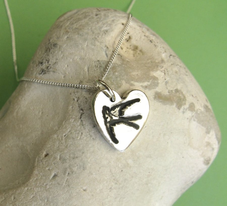 Fine silver heart necklace with bird