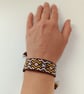 Brown & Mustard Woven Bracelet – Symbol of Friendship & Care - Image 2
