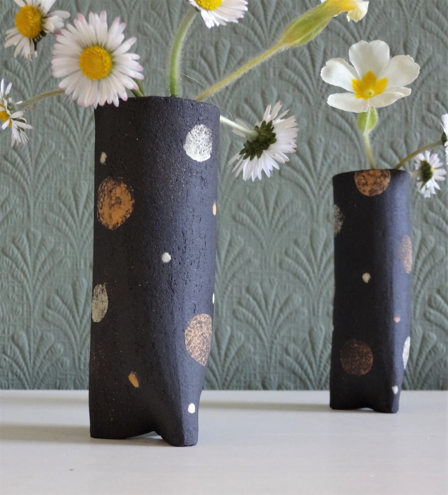 Set  of 2 small ceramic bud vases patterned with spots and dots.