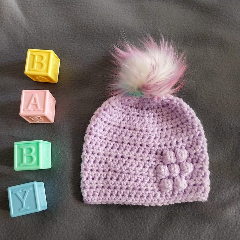 Lilac baby crocheted hat white faux fur pompom with orange purple & pink 