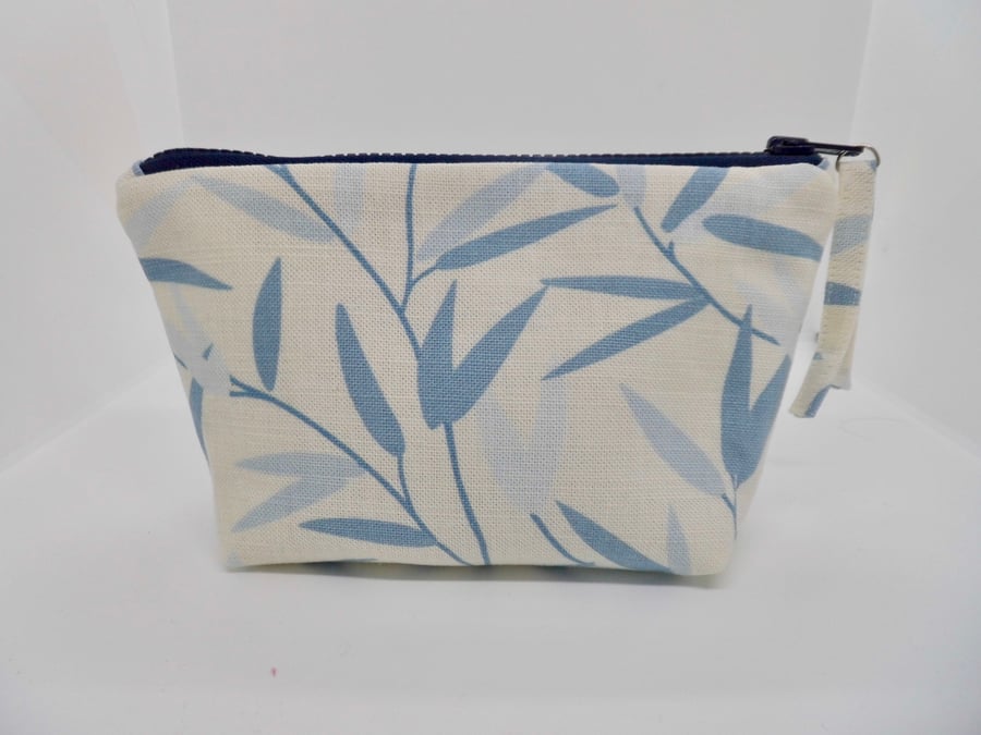 Zipped make up bag in blue leaf fabric 