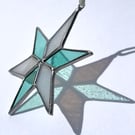 Pastel hued white and pale blue green stained glass Christmas star decoration
