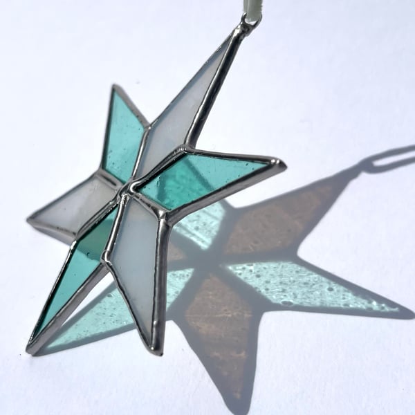 Pastel hued white and pale blue green stained glass Christmas star decoration
