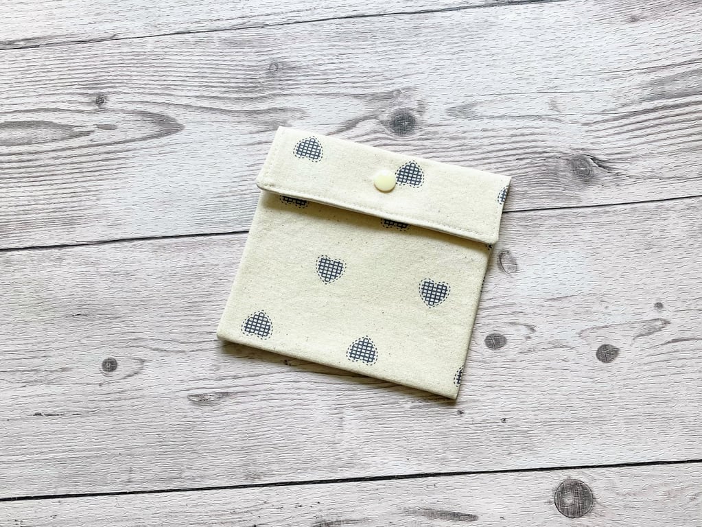 Discreet sanitary pouch. Feminine products holder. Cream with Blue hearts.