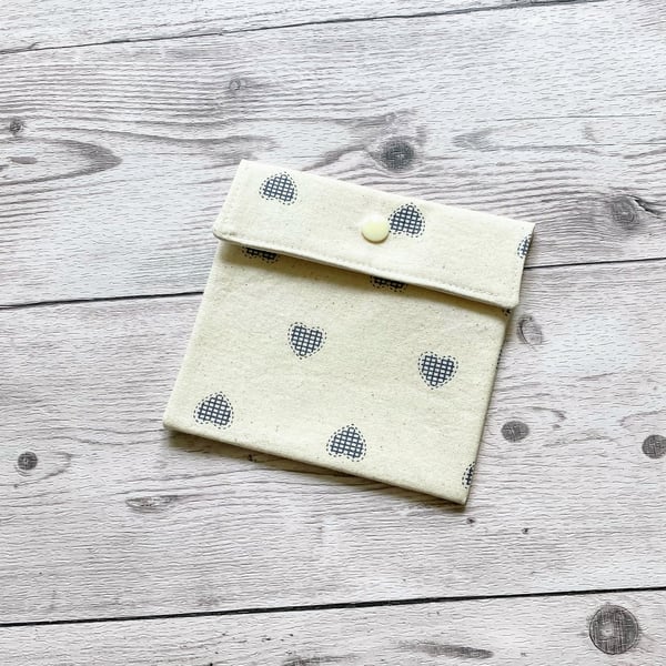 Discreet sanitary pouch. Feminine products holder. Cream with Blue hearts.