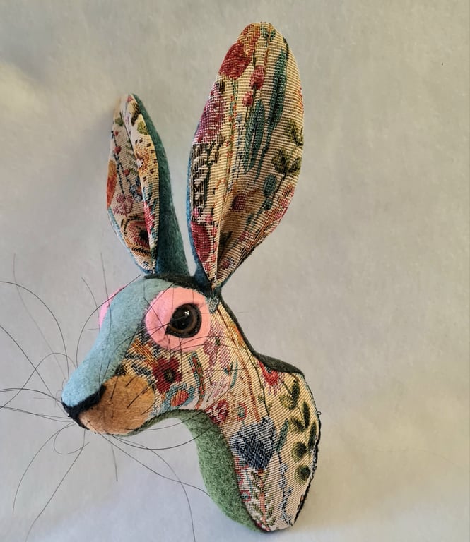 Faux hare head wall mount in floral tapestry fabric