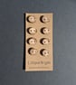 Set of eight small flat driftwood buttons - Image 2