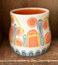 Ceramic hand thrown pot with unique orange and blue decoration - Image 1