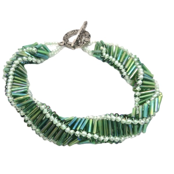 Handmade spiral beaded bracelet in green coloured bugle beads