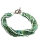 Handmade spiral beaded bracelet in green coloured bugle beads