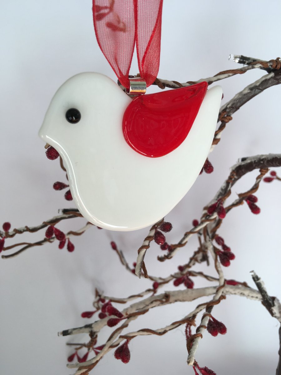 White glass bird with red wing