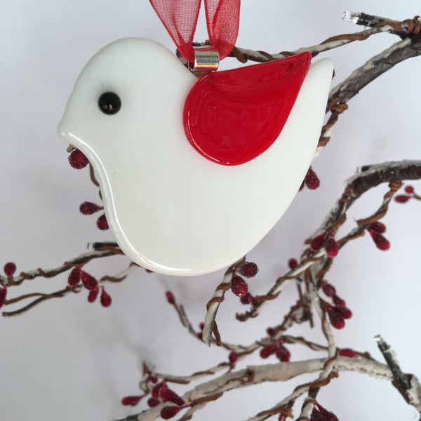 White glass bird with red wing