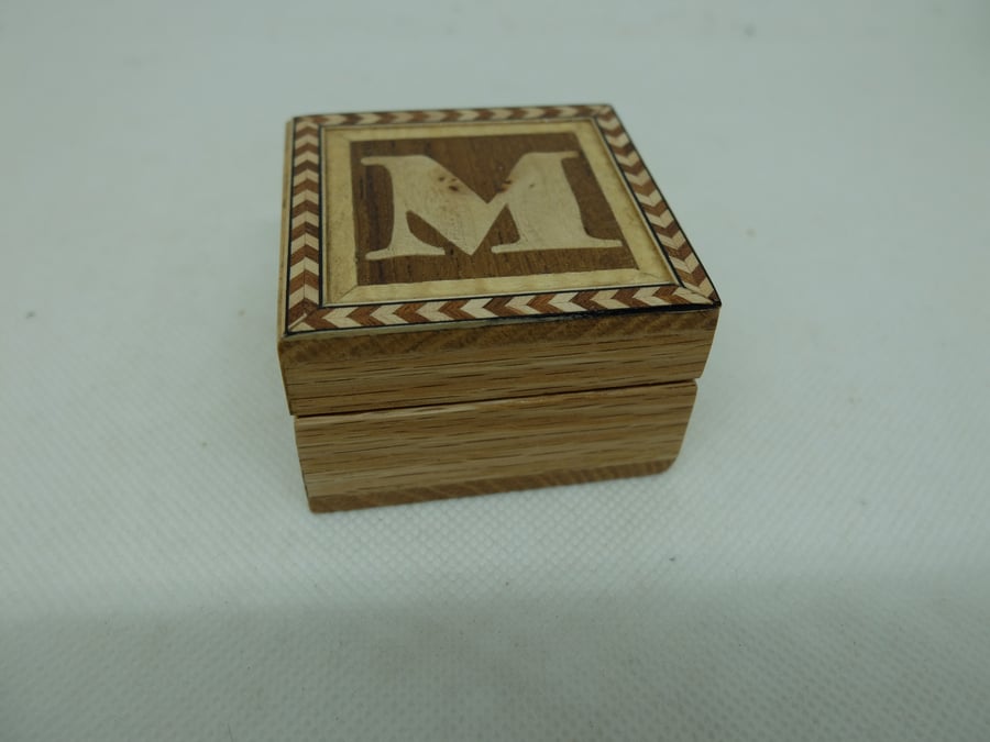 Small box with lift off lid, decorated with letter M
