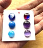 Six fused glass cabachons in blues and lilacs