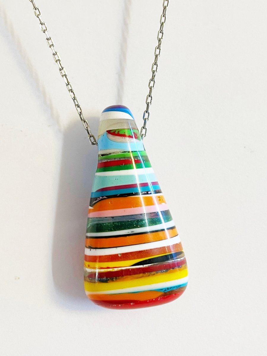 Layered resin pendant. hand carved.