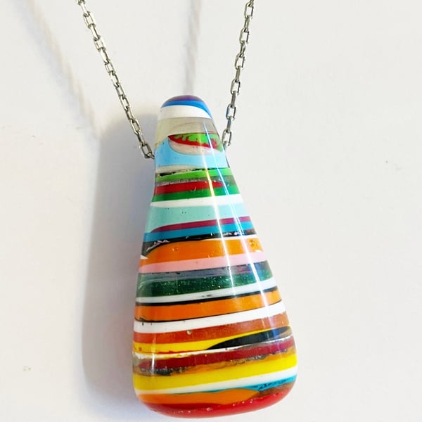 Layered resin pendant. hand carved.