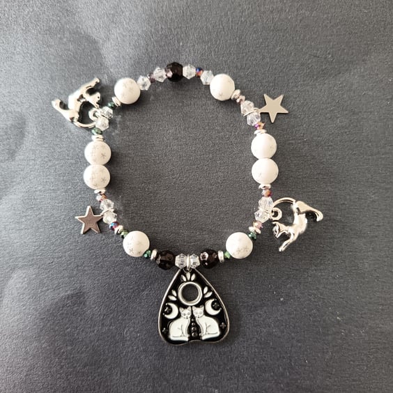 Elasticated black and white cat and star themed beads and charms bracelet 