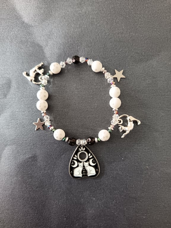 Elasticated black and white cat and star themed beads and charms bracelet 