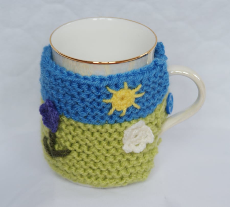 Knitted Cup Cozy with Flower and Sun