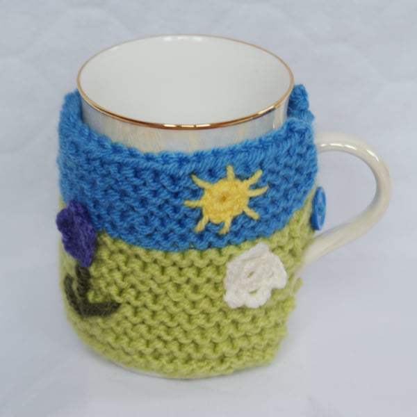 Knitted Cup Cozy with Flower and Sun