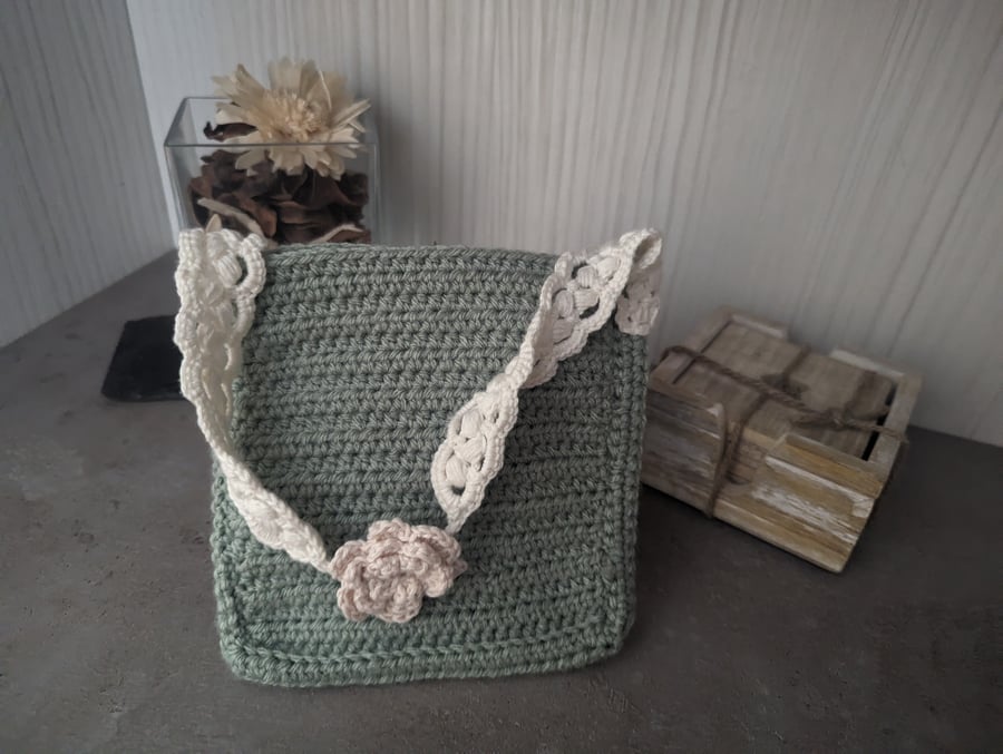 Children and toddlers crochet bag with flower detail.