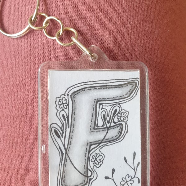 Hand drawn initial "F" keyring.