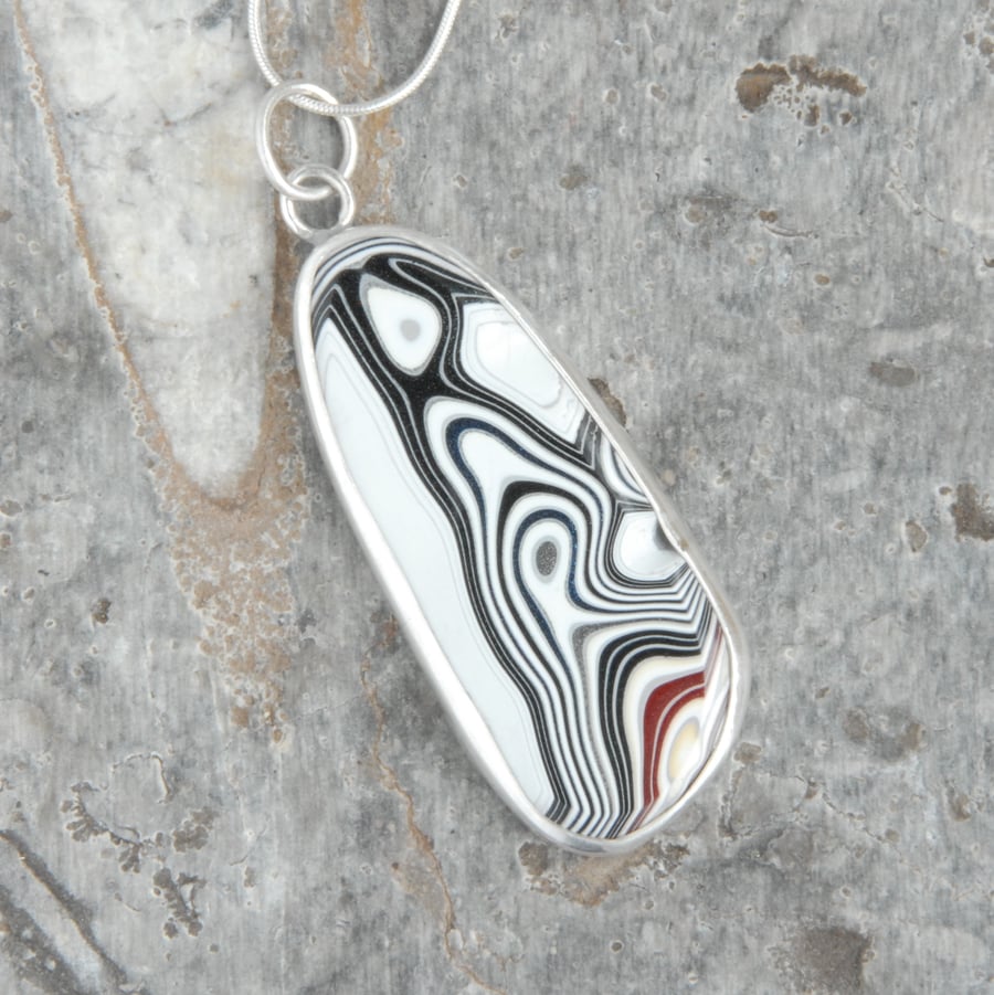 Reversible fordite and sterling silver pendant