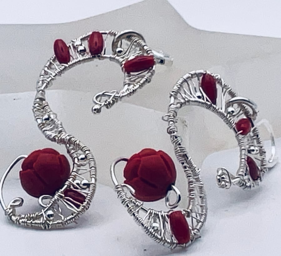 Statement S shaped earrings in carved red gemstones and dyed coral beads