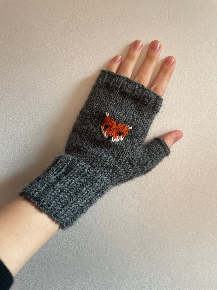 Hand knit dark grey wool fingerless gloves with embroidered fox pattern 