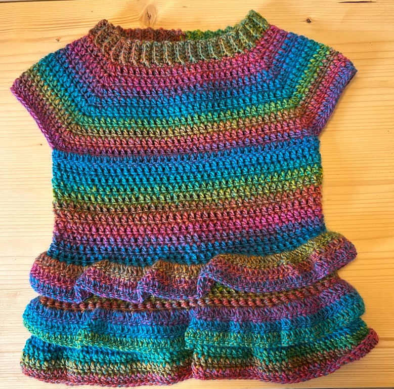 Tunic top with ra ra frills.