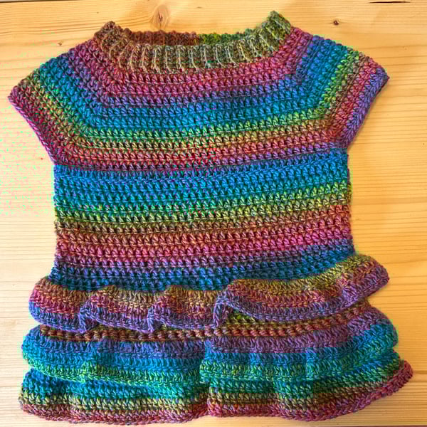 Tunic top with ra ra frills.