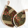 pair of leaf shaped pot holders in greens, patchwork quilted coasters