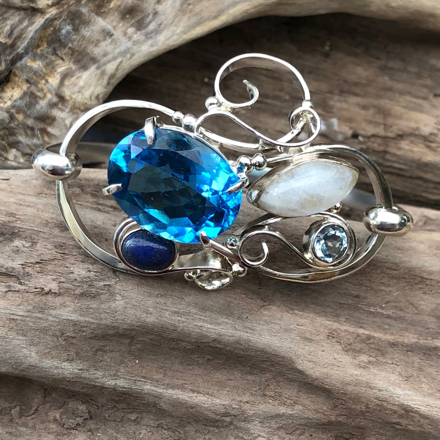 Sterling silver curl bracelet with blue gemstones  -00000328