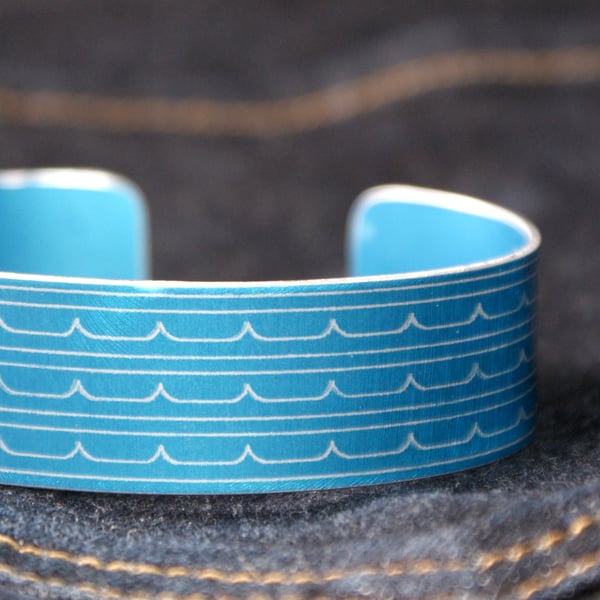 Wave pattern aluminium cuff blue