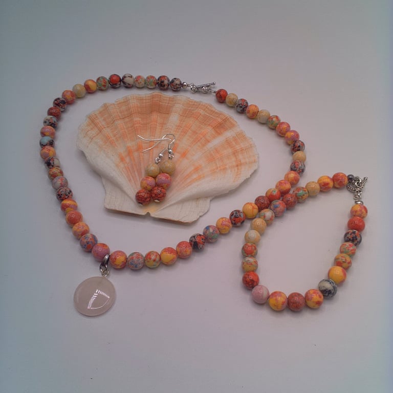 Mottled Pink Necklace With A Rose Quartz Circle Pendant a Bracelet and Earrings 