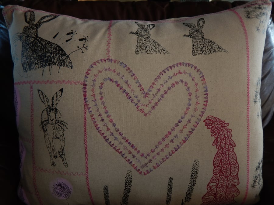 Large screen printed Hare cushion with wild flowers and heart. (60 cm by 50cm)